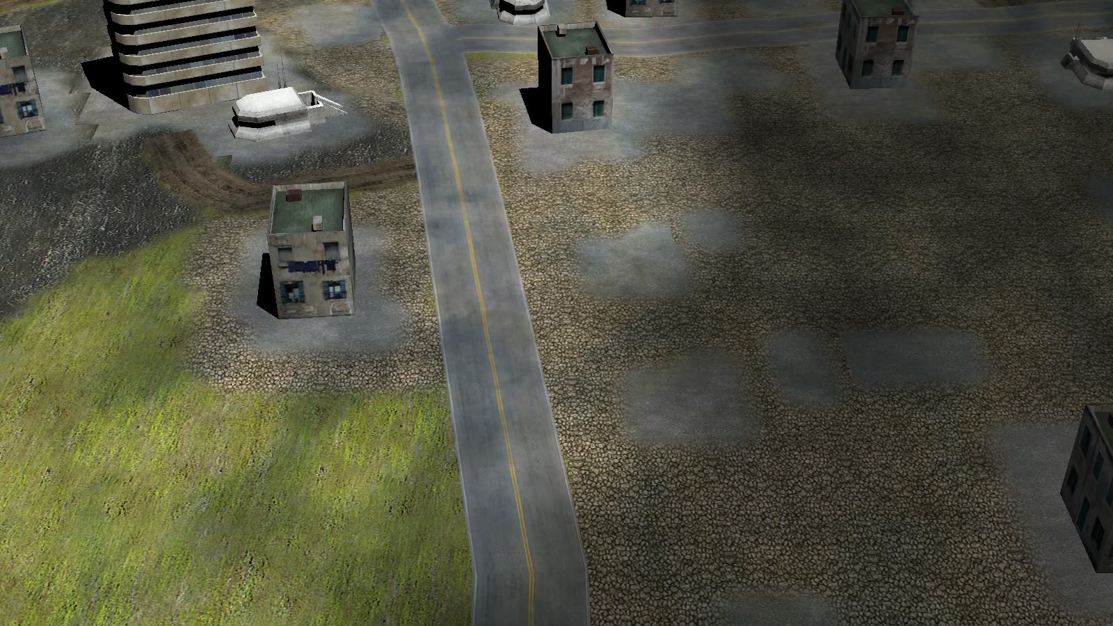 A generated C&C Generals city area with a curved paved road, blended terrain textures, and fitted stock buildings.